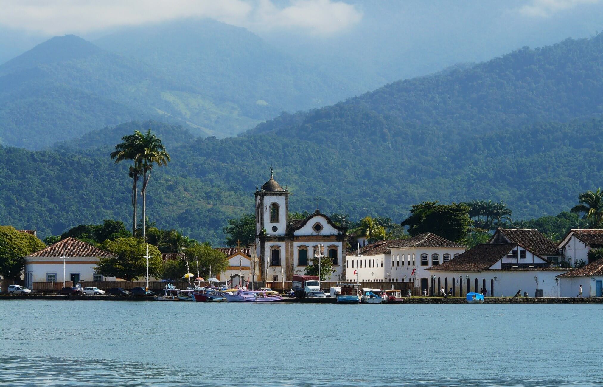 Colonial church and colourful waterfront houses in Paraty on Brazil's Costa Verde. 