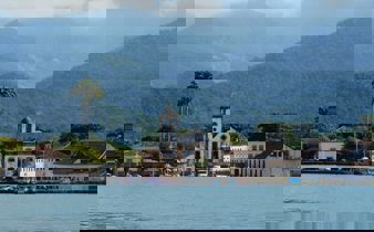 Colonial church and colourful waterfront houses in Paraty on Brazil's Costa Verde. 