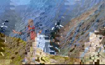 Hiker on the Inca overlooking Andes mountains near Machu Picchu, Peru adventure trek. 